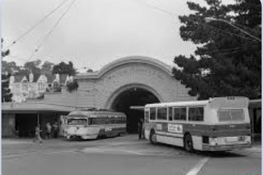 A busses parked in a tunnel

Description automatically generated