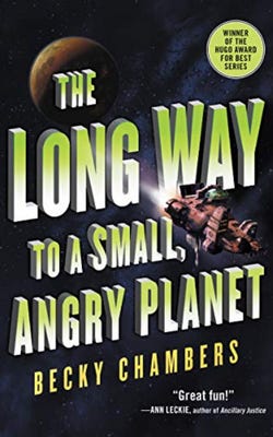 Book cover for The Long Way to a Small Angry Planet by Becky Chambers with an illustration of a planet and a spaceship flying away from it over a black backdrop