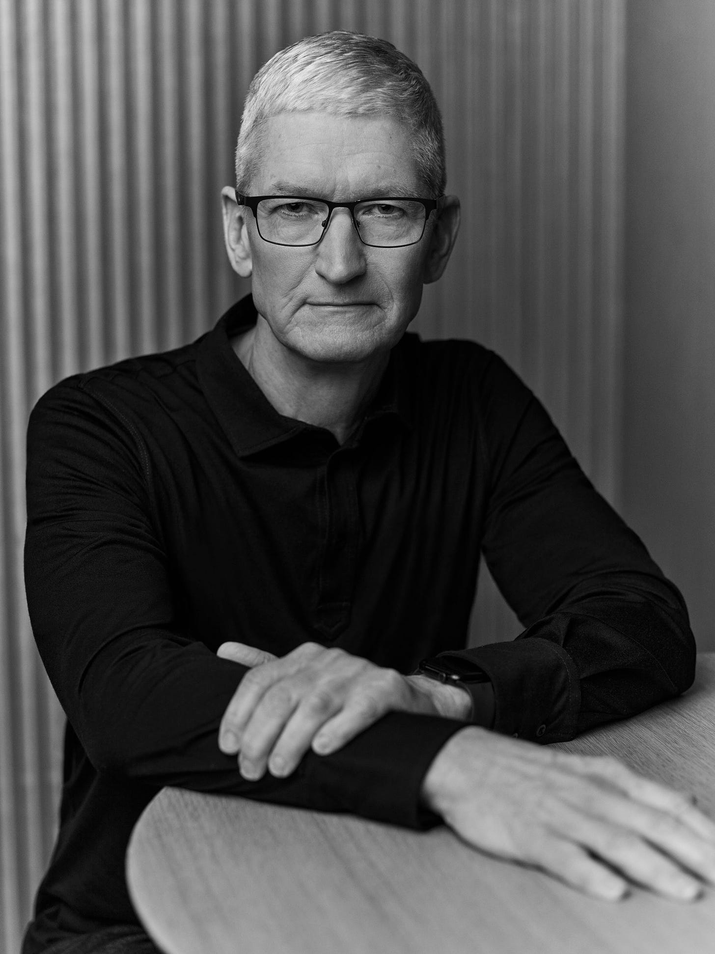 Image may contain Tim Cook Body Part Finger Hand Person Face Head Photography Portrait Adult and Accessories