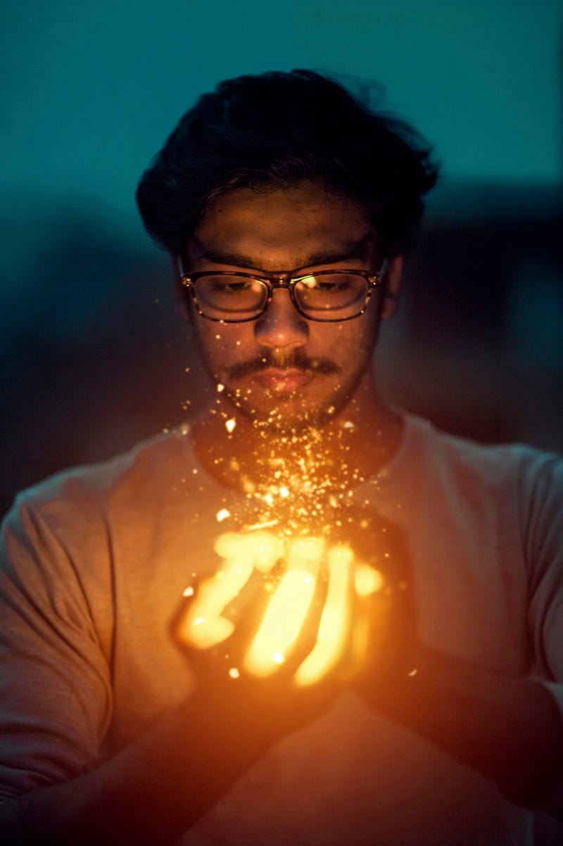 A person with magical flame in his hand. A person with magical flame in his hand.