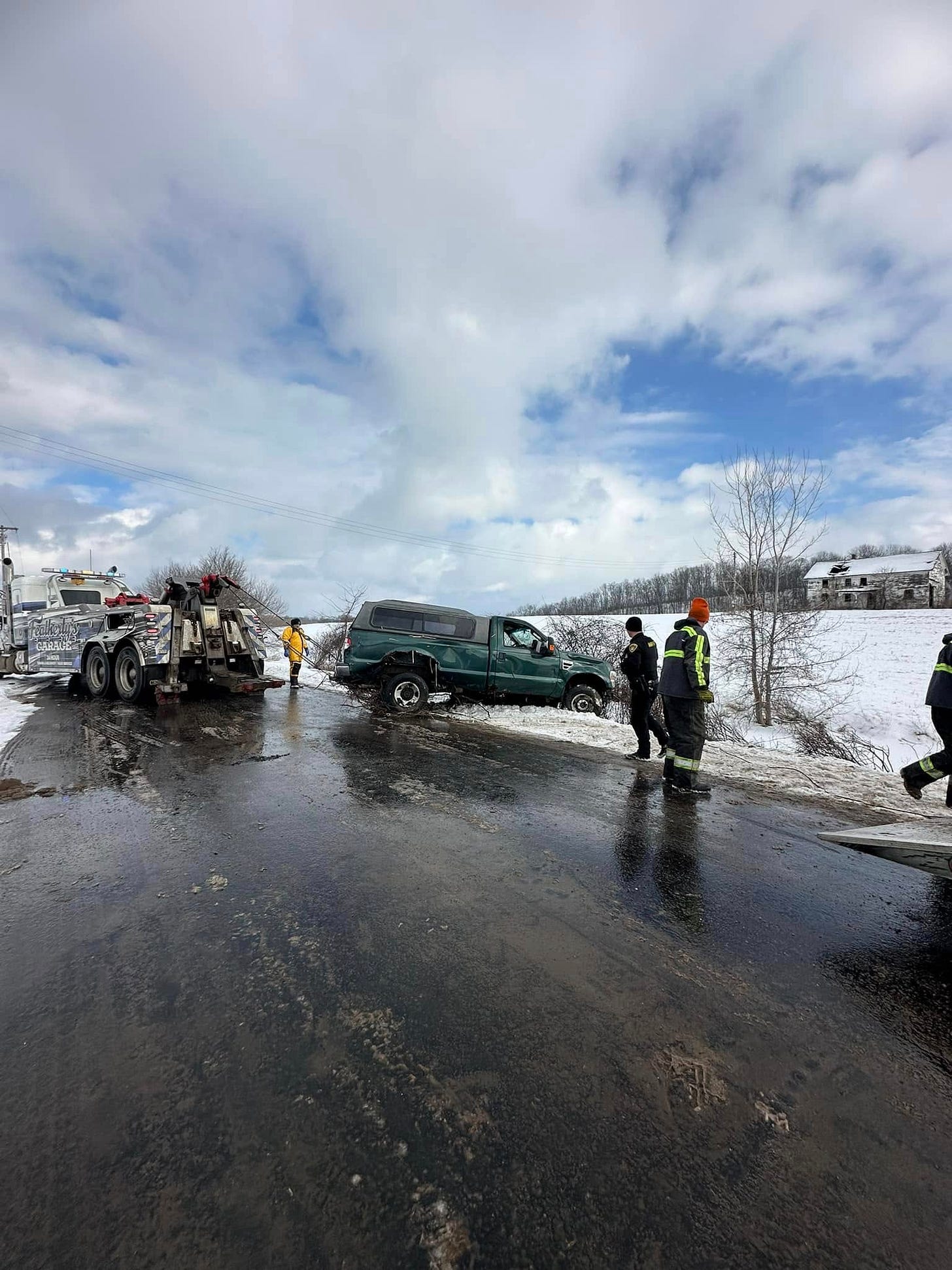 May be an image of 3 people, car and road