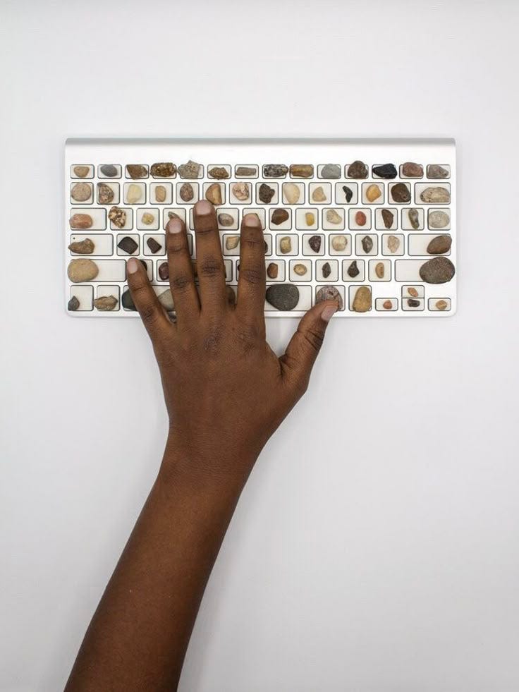 This may contain: a person's hand is typing on a computer keyboard