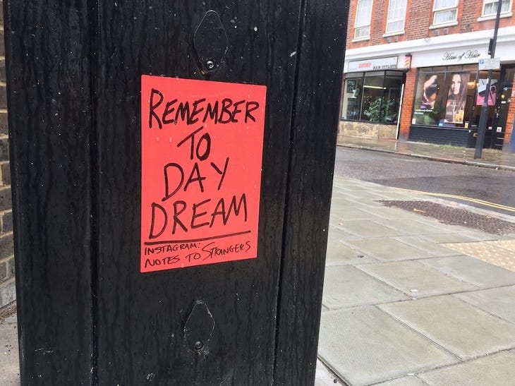 A poster saying 'Remember to Daydream'