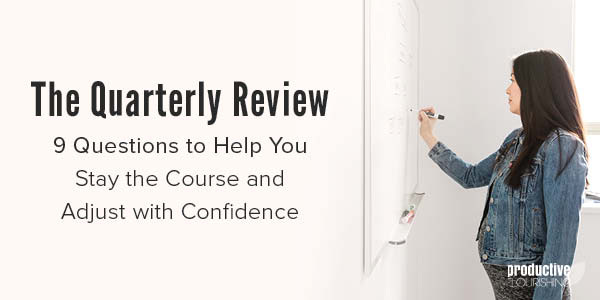 A woman is writing on a whiteboard on the wall. Text Overlay: The Quarterly Review - 9 Questions to Help You Stay the Course and Adjust With Confidence