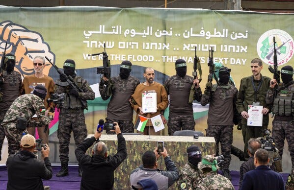 Hamas says it will delay the release of more hostages, putting Gaza  ceasefire at risk | AP News