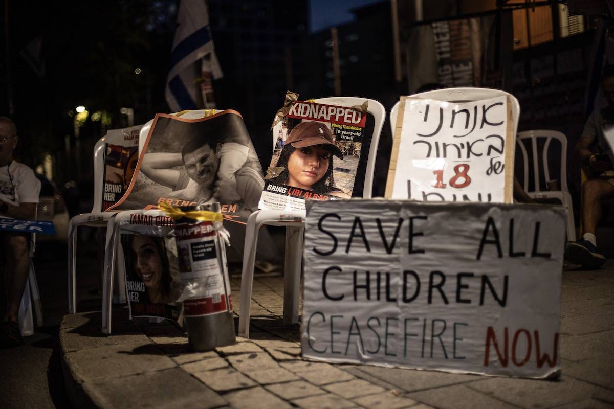 A view of the portraits of the Israeli captives in Gaza as families of Israeli captives in Gaza, holding banners and flags, gather to protest against the Israeli government in Tel Aviv, Israel on October 24, 2023. [Mostafa Alkharouf - Anadolu Agency]