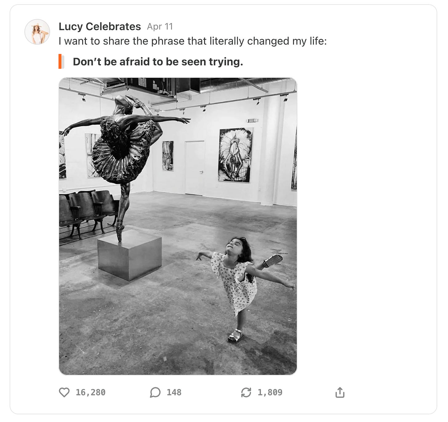 Photo of a statue of a woman dancing and a girl doing the same