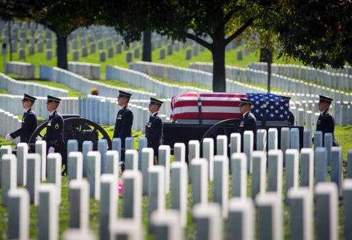 File photo: A caisson carrying the casket containing the remains of Army Sgt. 1st Class Andrew T. Weathers proceeds to the burial service at Arlington National Cemetery in Arlington, Va., Oct. 17, 2014.
