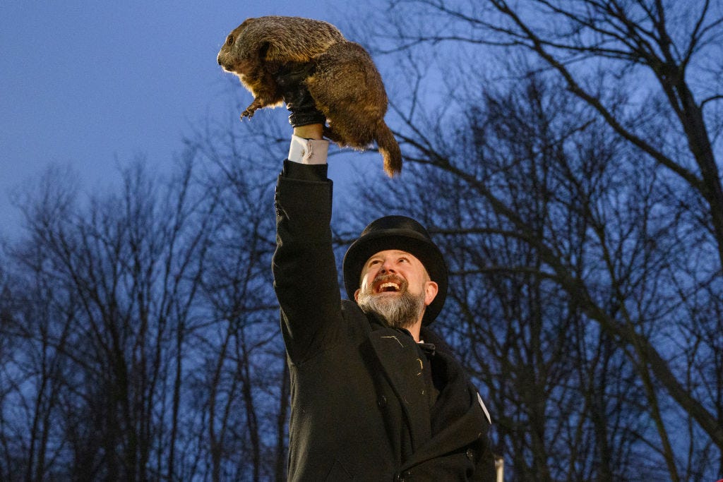 Groundhog handler AJ Dereume holds Punxsutawney Phil after he did not see his shadow, predicting an early Spring, during the 138th annual Groundhog Day festivities on February 2, 2024 in Punxsutawney, Pennsylvania. (Photo by Jeff Swensen/Getty Images)