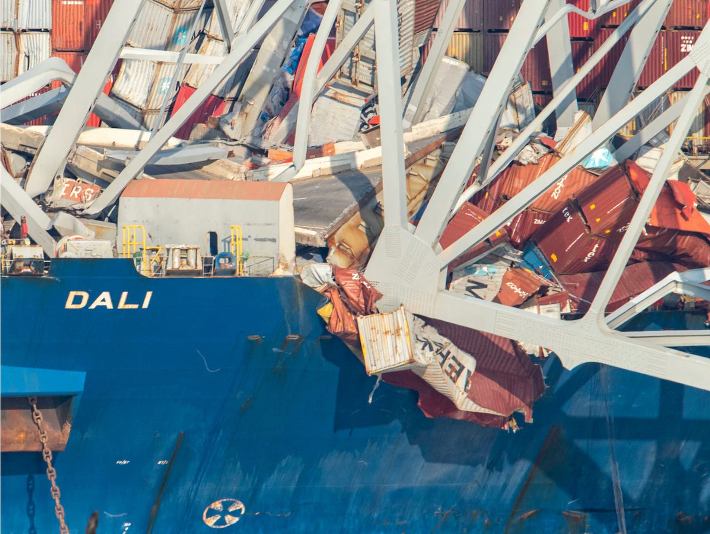 The bow of the container ship Dali, pinned underneath the wreckage of the Francis Scot Key bridge in Baltimore Harbor