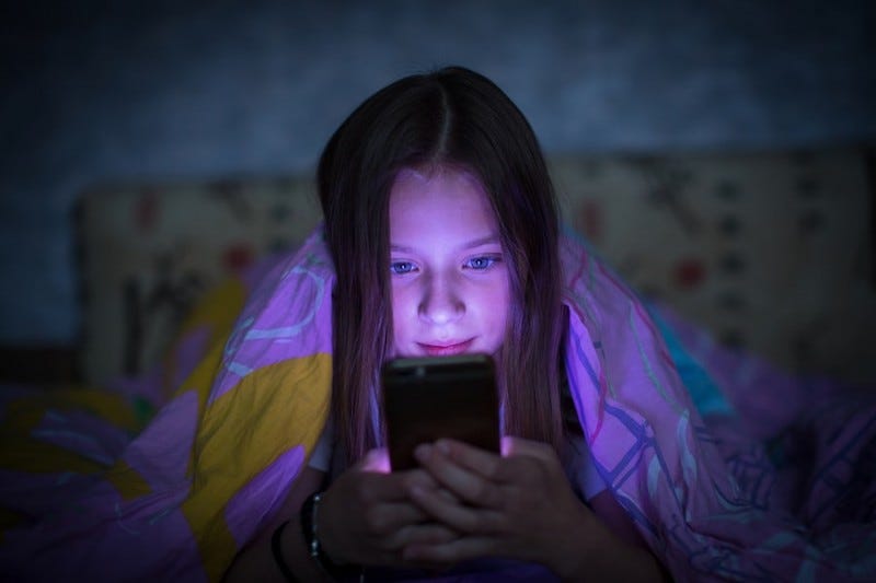 How looking at screens in the dark can impact your child's ...