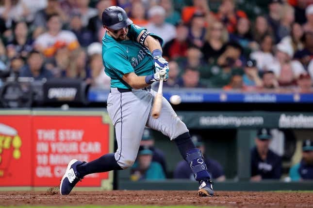 May 5, 2024; Houston, Texas, USA; Seattle Mariners catcher Cal Raleigh (29) hits a solo home run against the Houston Astros during the ninth inning at Minute Maid Park.
