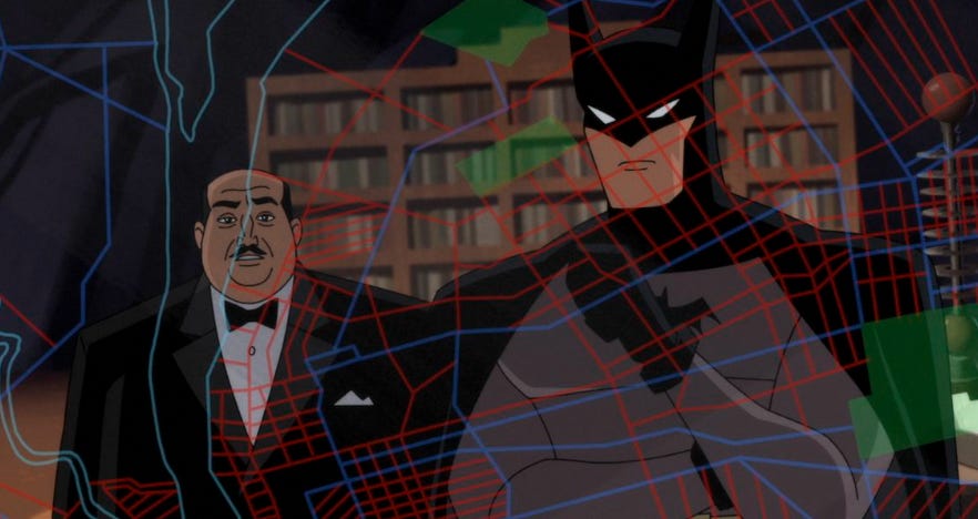 Alfred and Batman studying a map of Gotham