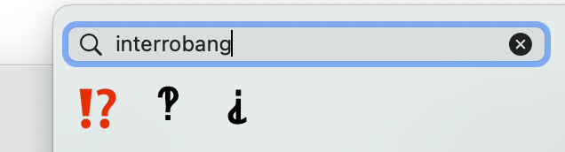 A photo of an "interrobang" emoji search showing the three results