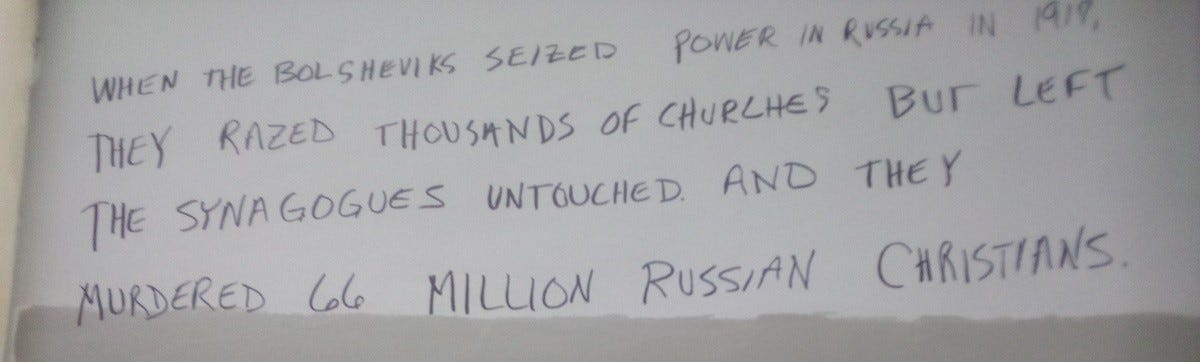 Graffiti reading: "When the Bolsheviks seized power in Russia in 1917, they razed thousands of churches but left the synagogues untouched. Then they murdered 66 million Russian Christians.