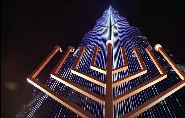 A large Menorah was ceremoniously lit each night during Hanukkah at the base of Dubai's Burj Khalifah. [Newzee/YouTube]