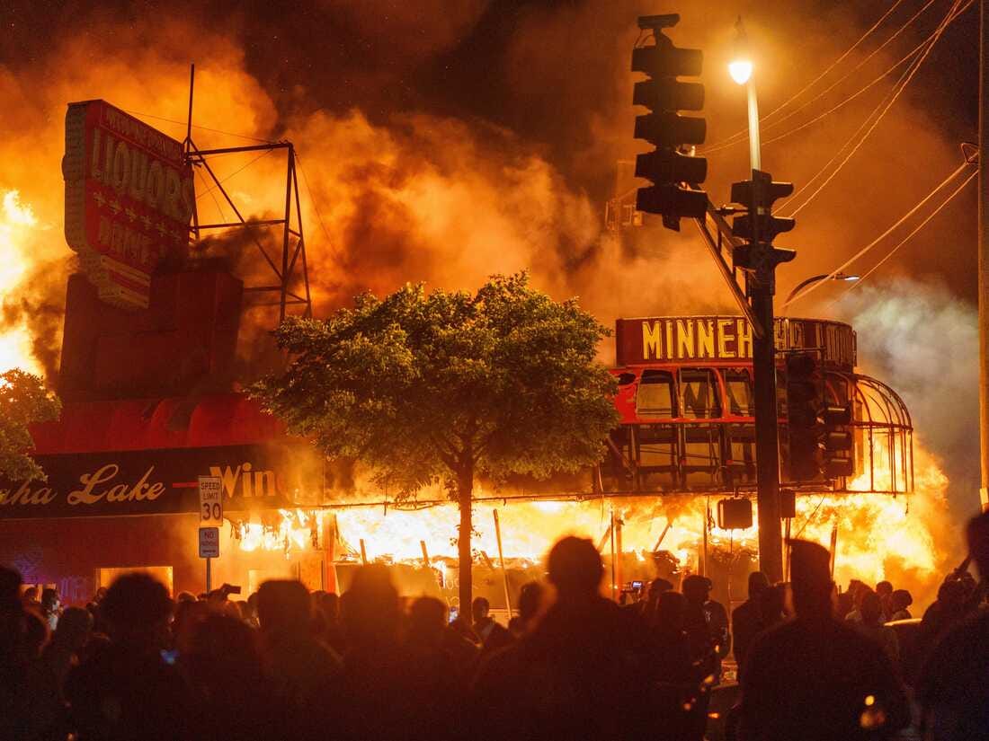 A liquor store in flames near the Third Police Precinct on May 28, 2020 in Minneapolis, Minnesota, during a protest over the police killing of George Floyd.