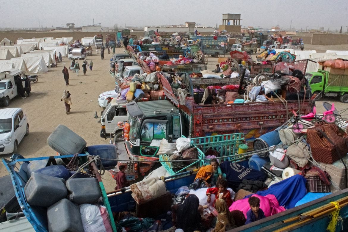 Afghan refugees arrive at a holding centre before their departure to Afghanistan near Pakistan-Afghanistan border in Chaman. [Abdul Basit / AFP]