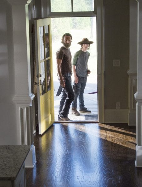 carl and rick grims look into new house walking dead 2015 images