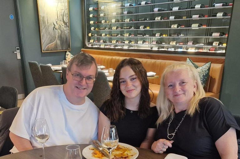 Julian Martin with his daughter Millie, 19, and partner Lesley Bennett, 62.