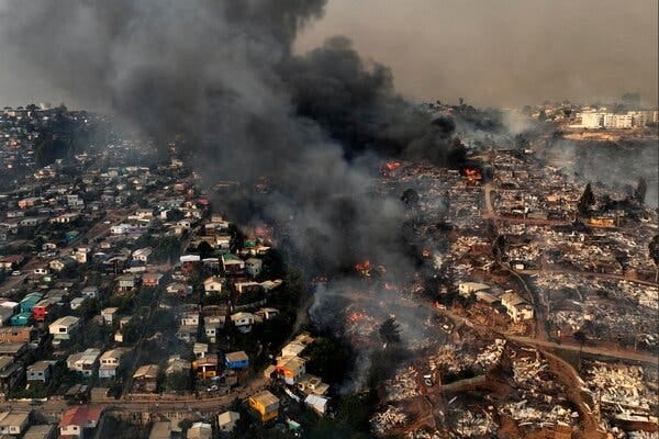 An aerial view of a city on fire.