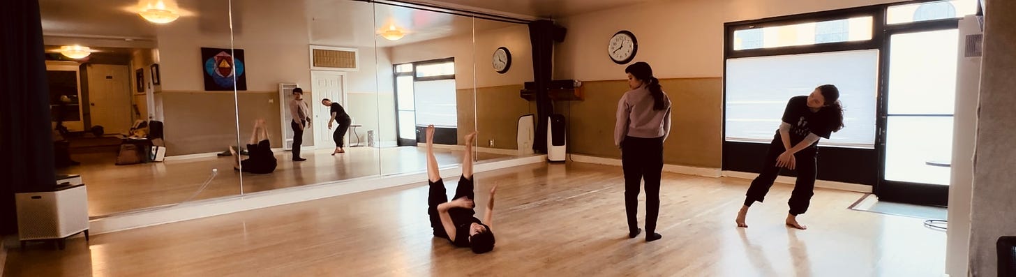 Three dancers in a dance studio