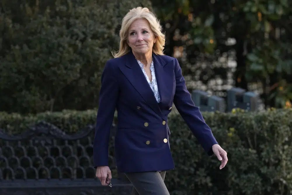First lady Jill Biden walks out of the White House in Washington, Wednesday, Jan. 11, 2023, as she and President Joe Biden prepare to board Marine One. The White House says surgeons have removed a cancerous lesion above first lady Jill Biden’s right eye and one on her chest, and that a third lesion on her left eyelid is being examined. (AP Photo/Susan Walsh)