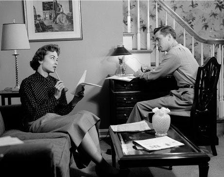 Vintage couple in living room talking meeting.