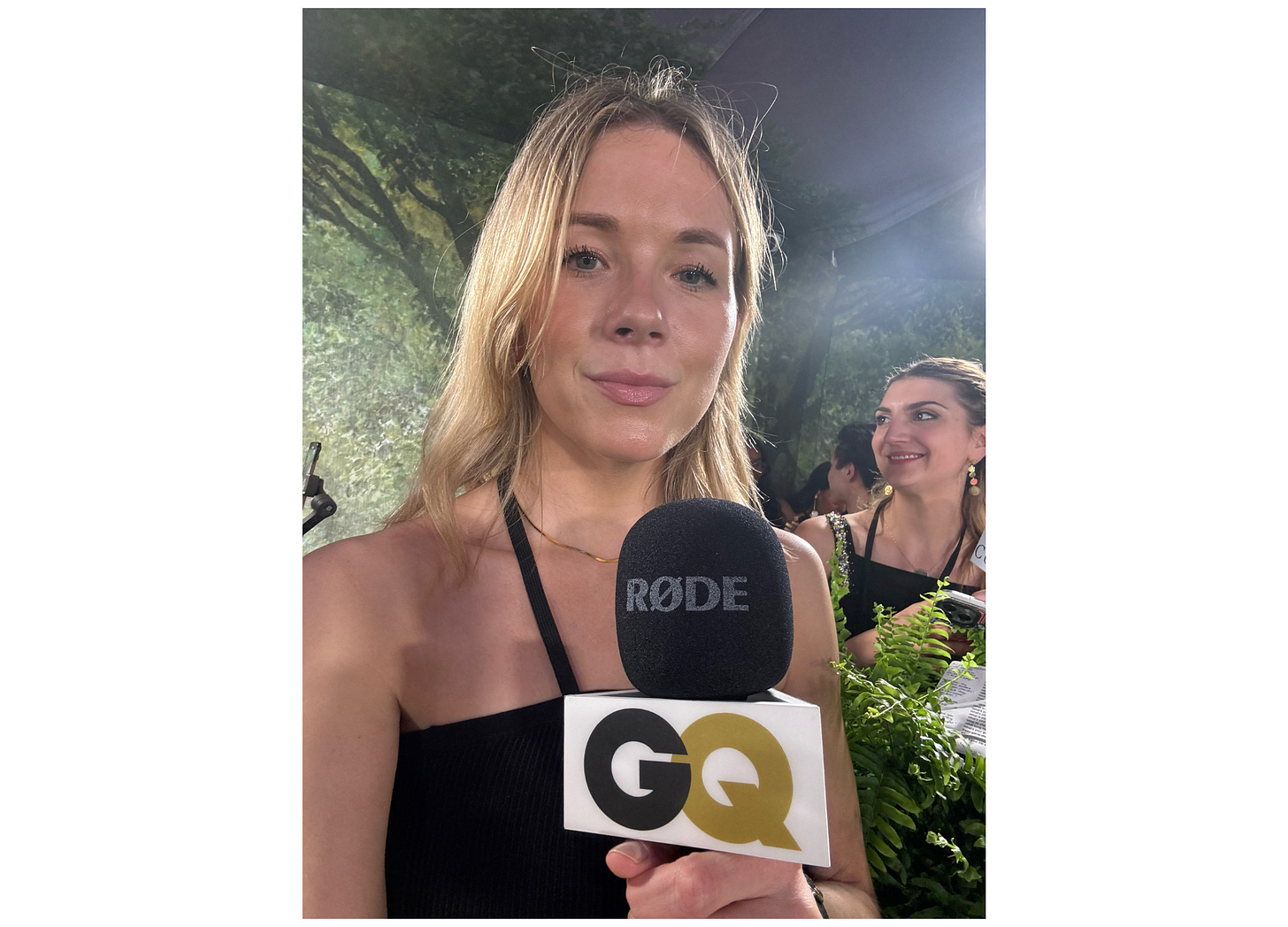 Photo of Katie holding the GQ microphone