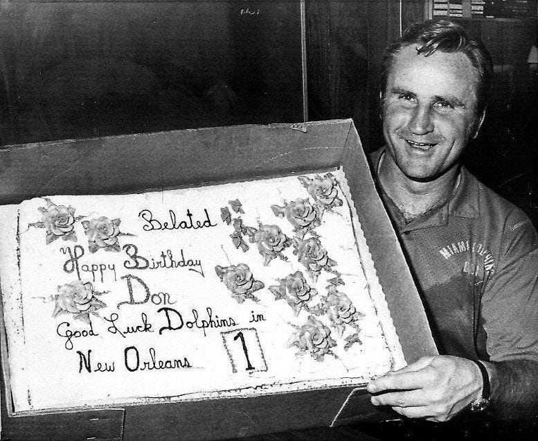 Don Shula holding his birthday cake on January 4, 1974, while preparing to play in Super Bowl VIII.