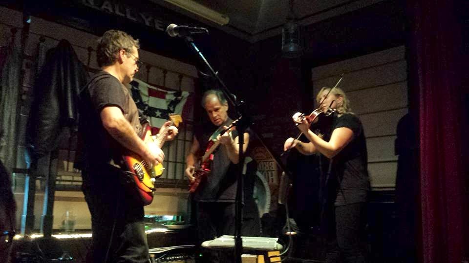 Richard Shindell (left) performing at the Dogwood bar in Beacon, N.Y. in 2015 with fiddler Sara Milonovich, guitarist Marc Shulman and Joe Bonadio on percussion. Richard Shindell (left) performing at the Dogwood bar in Beacon, N.Y. in 2015 with fiddler Sara Milonovich, guitarist Marc Shulman and Joe Bonadio on percussion.