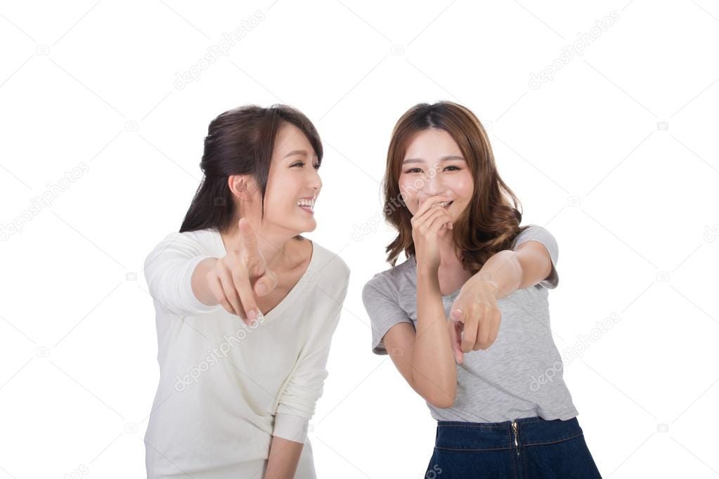 Asian woman laughing and pointing Stock Photo by ©elwynn 94867220