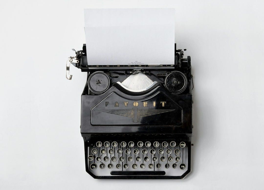black Fayorit typewriter with printer paper black Fayorit typewriter with printer paper
