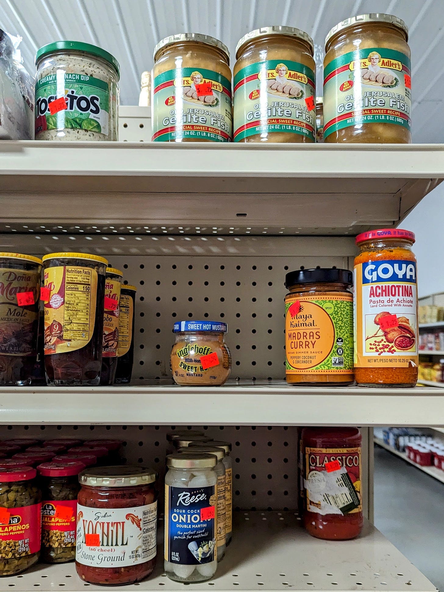 Grocery store shelves with a variety of food jars