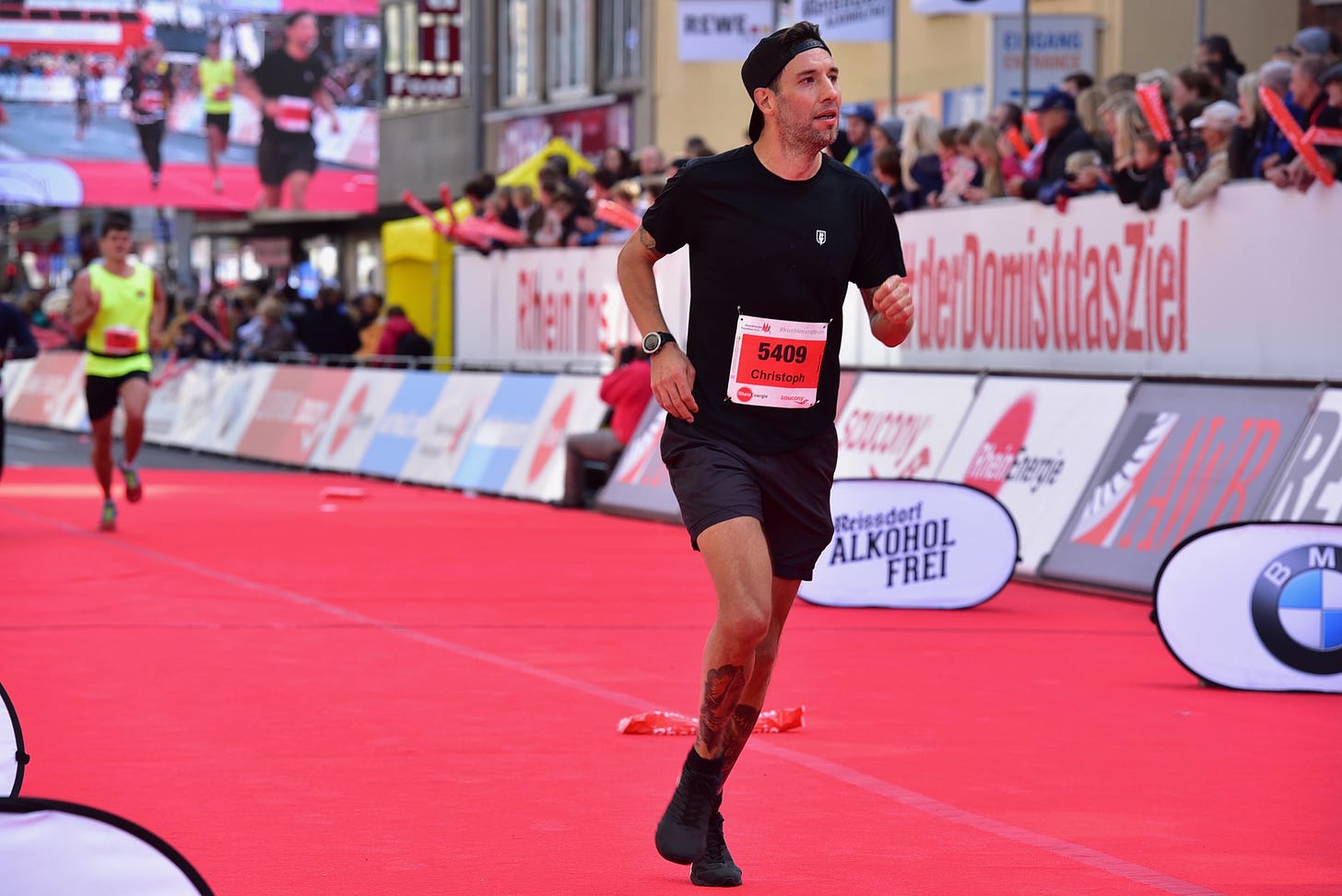The author crossing the finish line at the Cologne Marathon