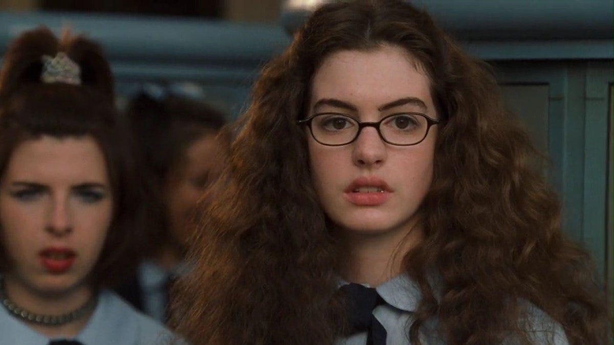 Mia Thermopolis leaning against a locker, next to her friend Lilly Moscovitz.