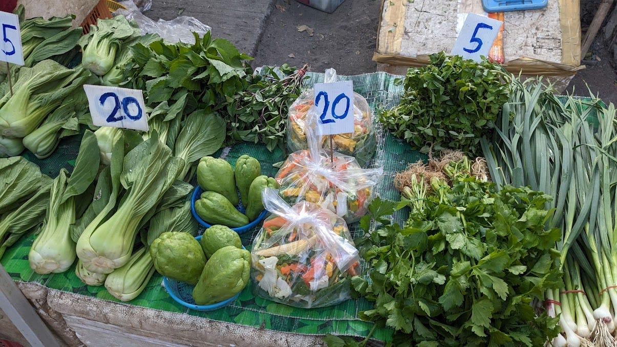 a table of farmers market greens in thailand