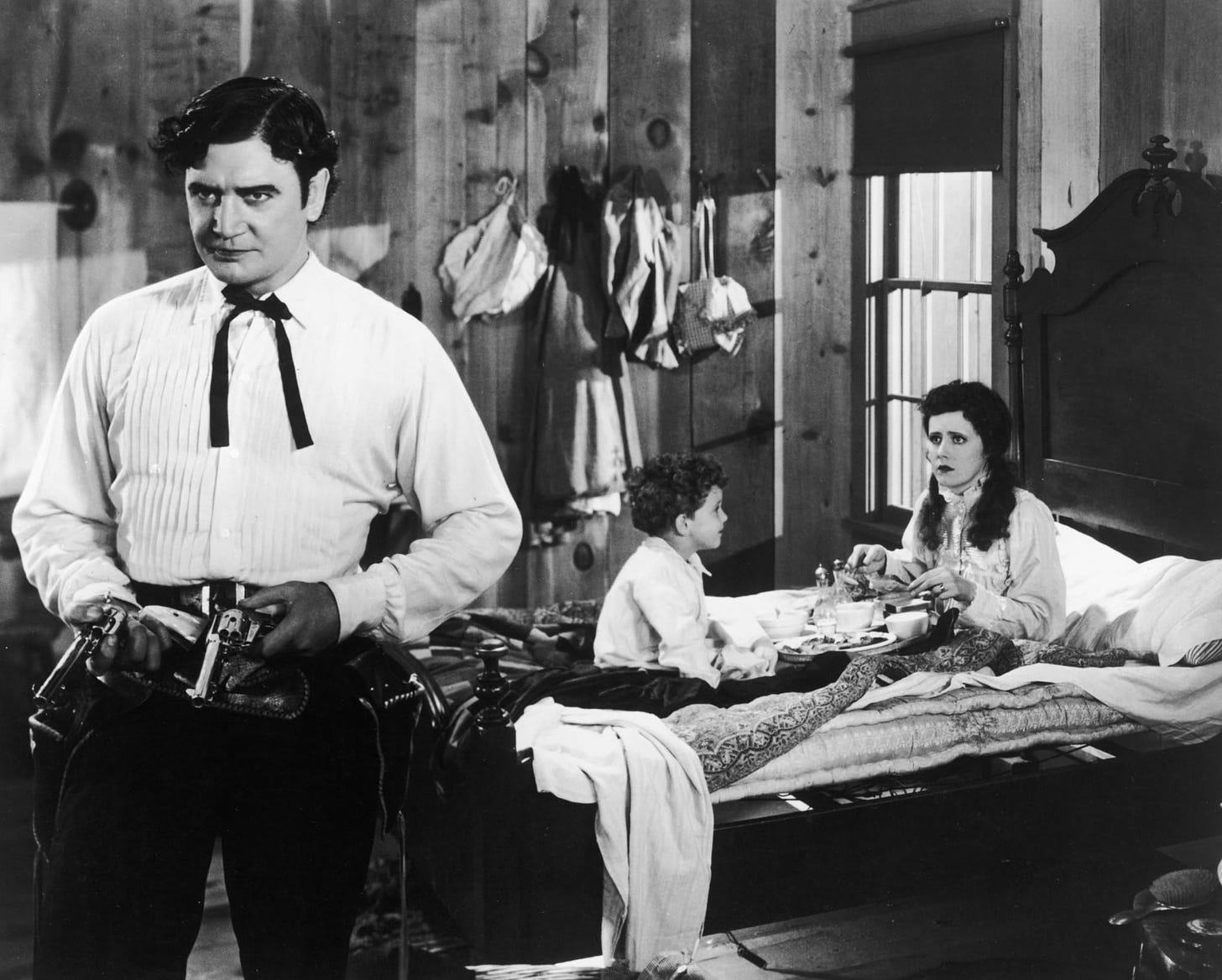 Richard Dix, Douglas Scott, and Irene Dunne in a scene from Cimarron