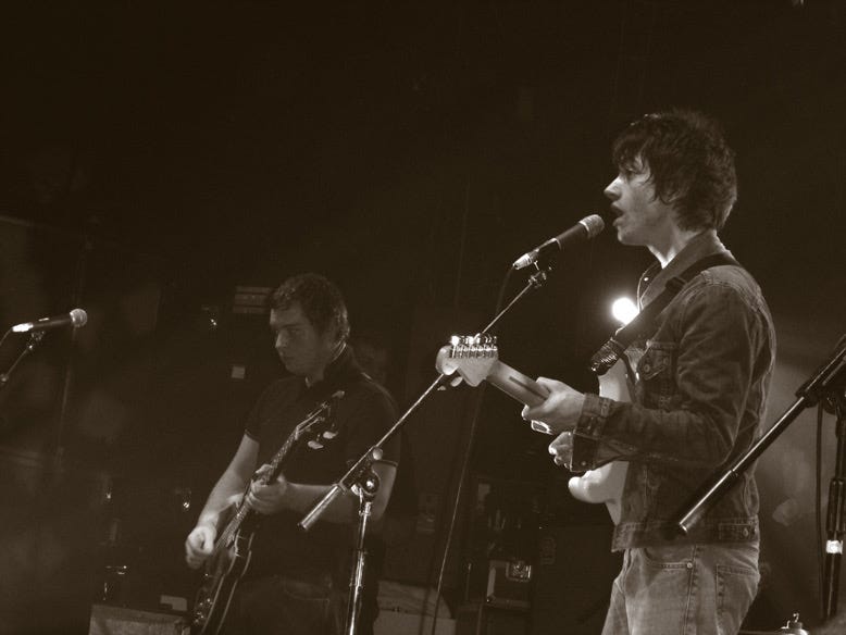 CC-BY-licensed photo of the Arctic Monkeys in Jan 2006 by Laura on Flickr https://www.flickr.com/photos/kokalola/274145609/