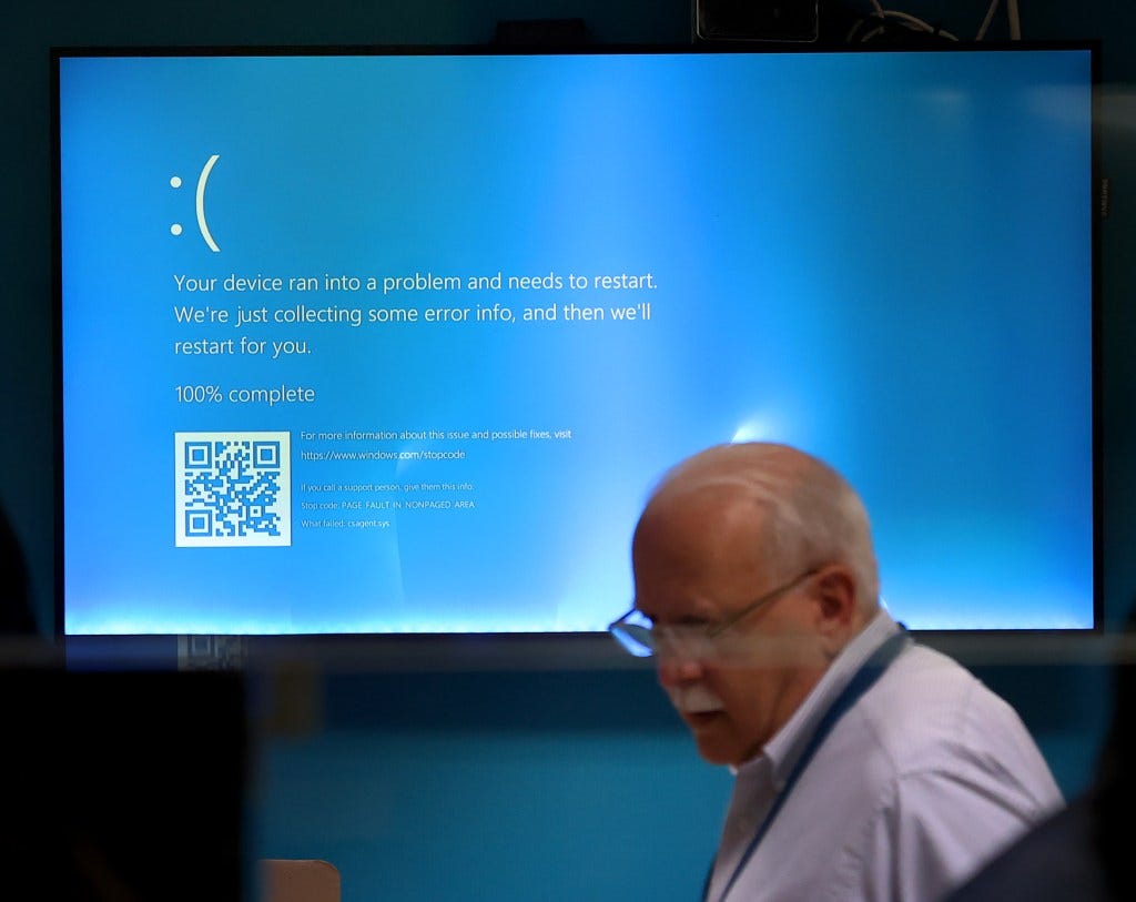 Blue screen of death on display at the Amtrak South Station ticket area, due to the CrowdStrike outage.