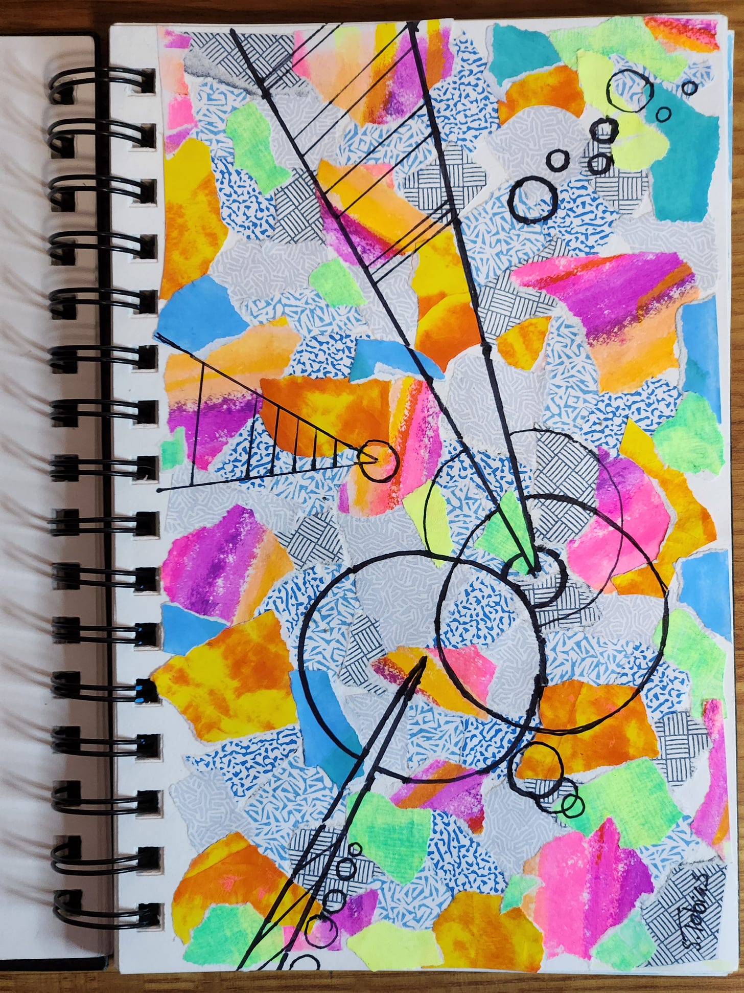 colorful torn paper collage with lines and circles randomly placed.