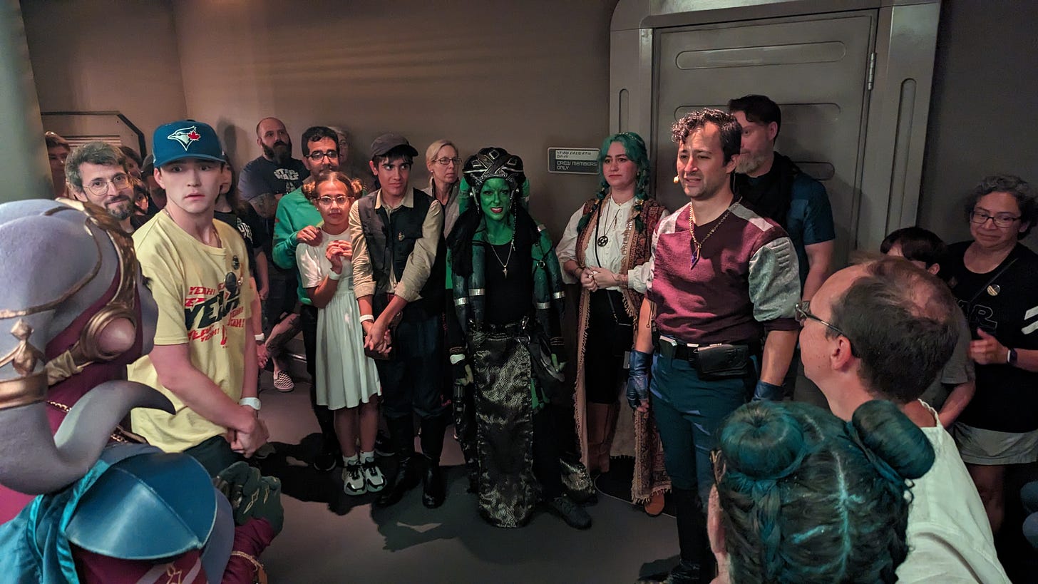 A group of people, including Gaya and Raithe Kole, huddled in the Halcyon's cargo hold together