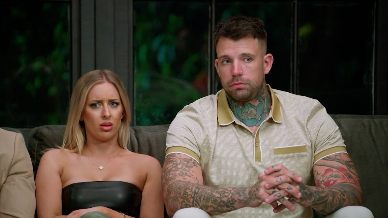 Jamie looks confused while listening to another MAFS couple on the couch, sitting next to Dave. 