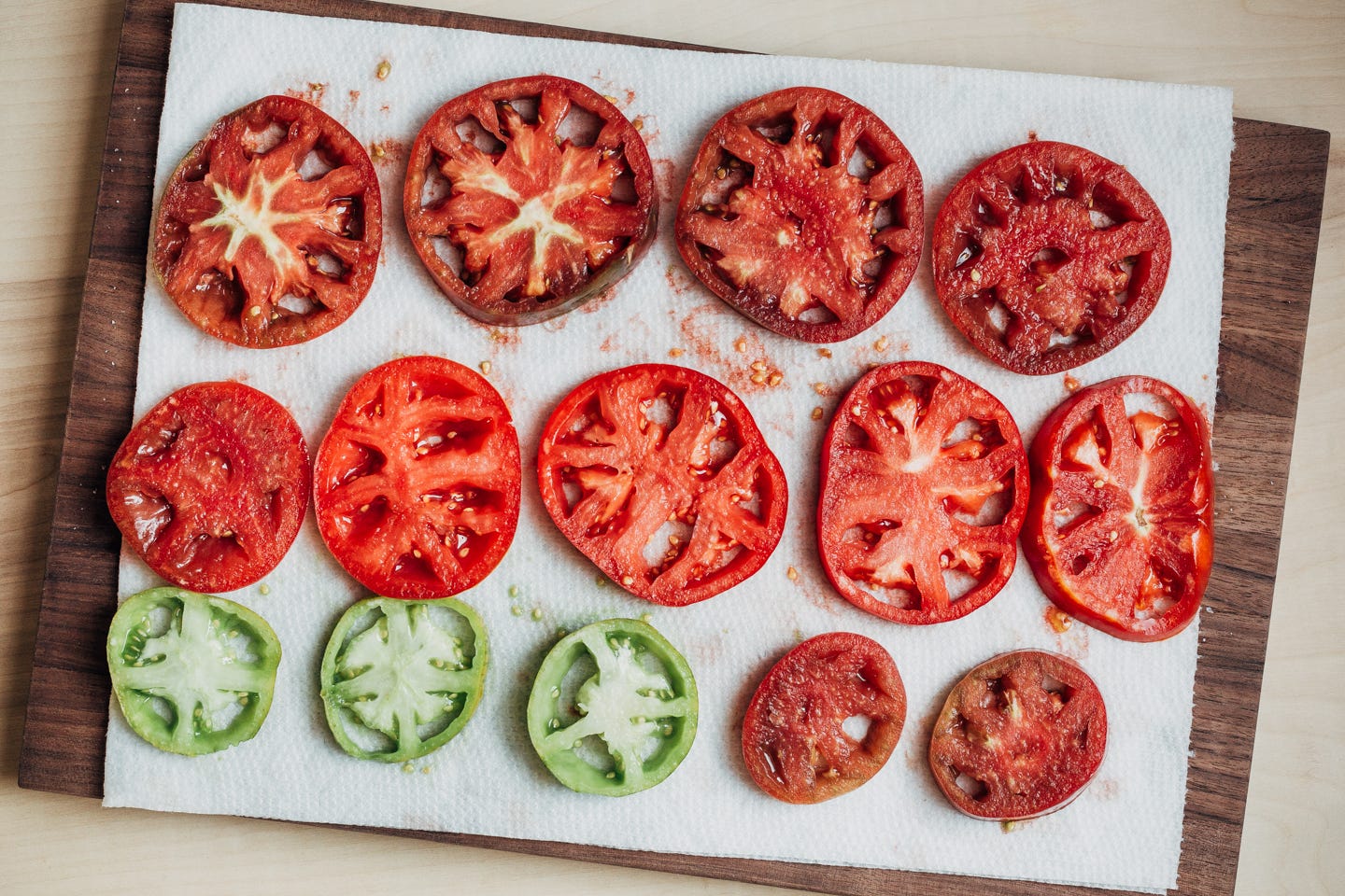 Sliced tomatoes on a paper towel