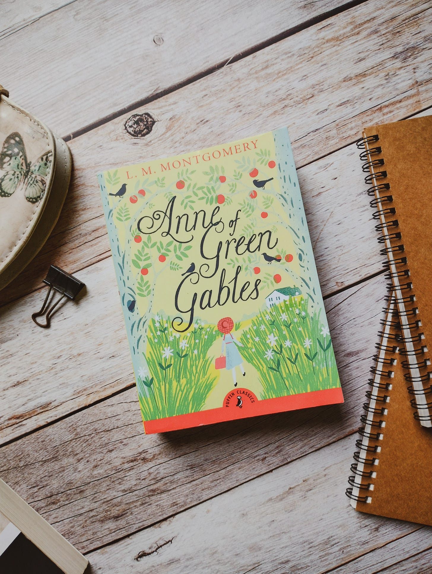 Puffin children’s classics, Anne of Green Gables by L.M. Montgomery, on a wooden table