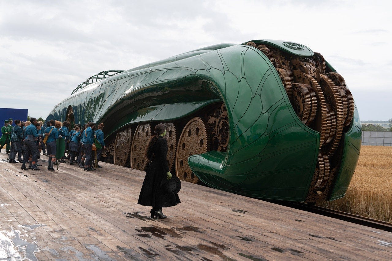 A green steampunk train with visible gears.