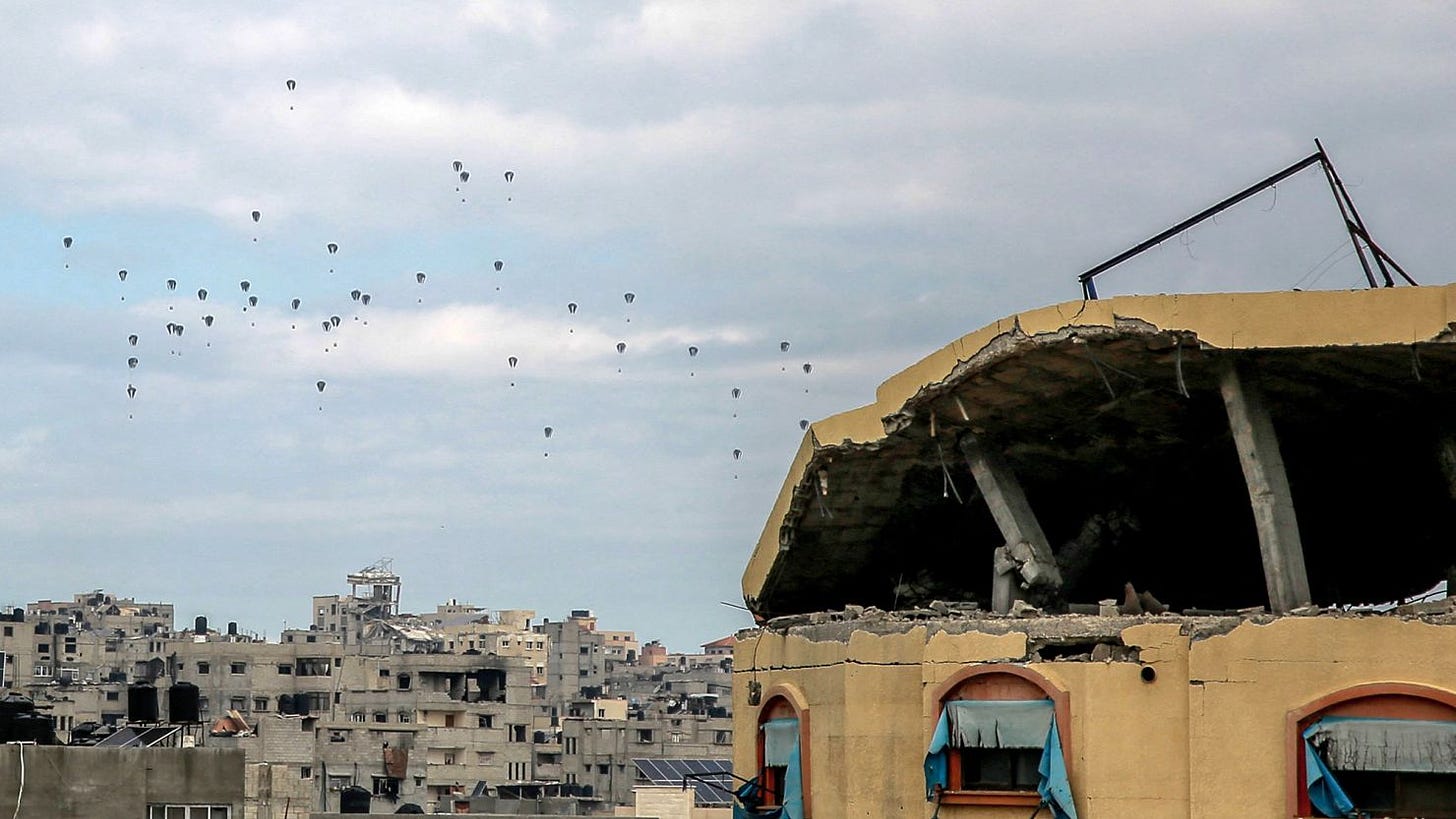 Aid parcels are airdropped over the northern Gaza Strip on Friday.