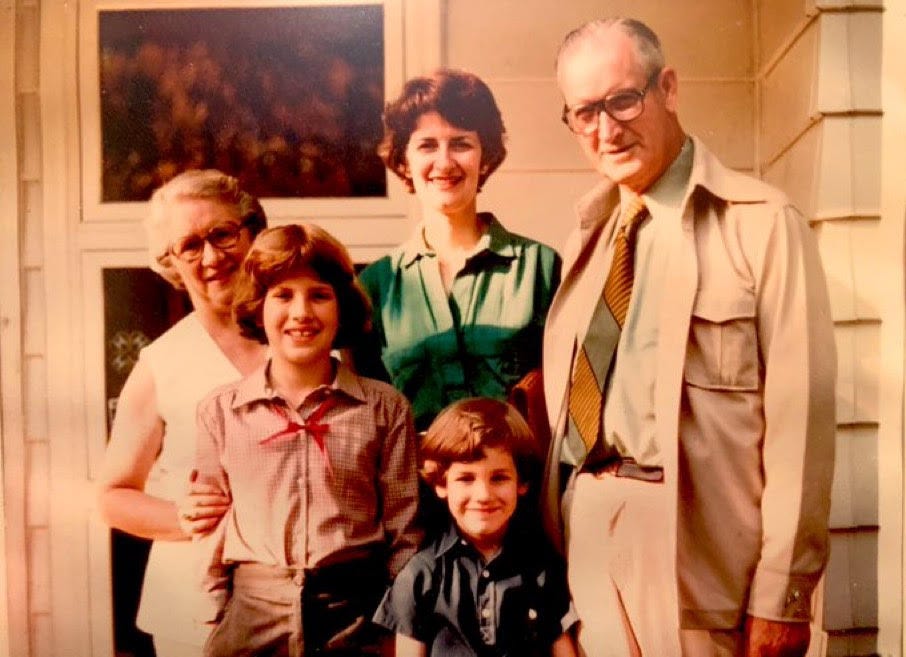 An older couple with a young-ish woman and two children