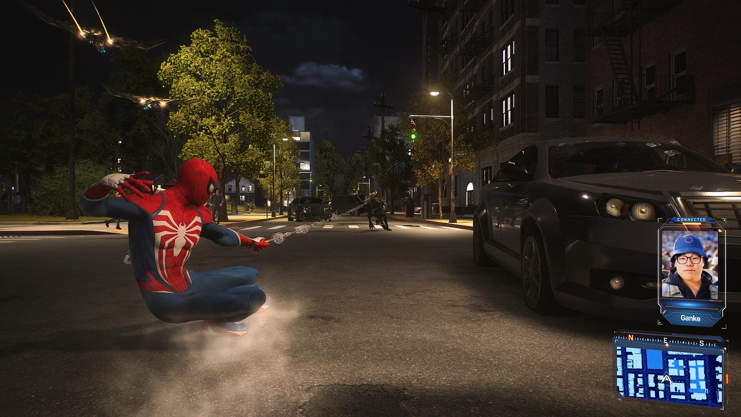Spider-Man being dragged along a road by a robot dog he's webbed