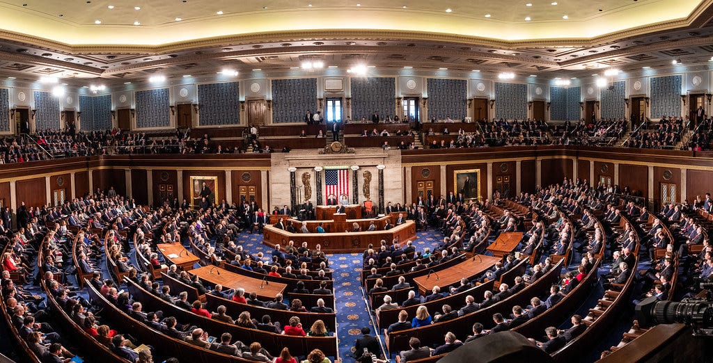 Interior of the United States Senate, with senators seated at their desks and voting on legislation.